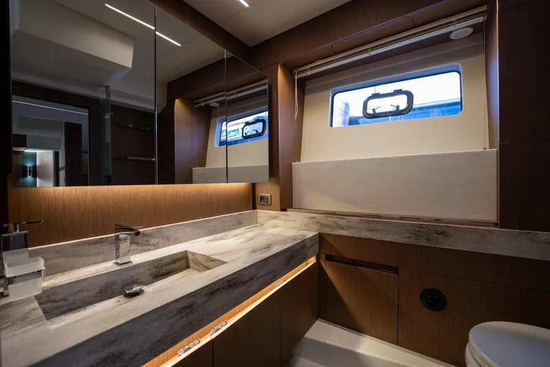 Yacht Photos Pics Luxurious bathroom interior of 2023 Prestige X60 yacht with modern fixtures and elegant design.