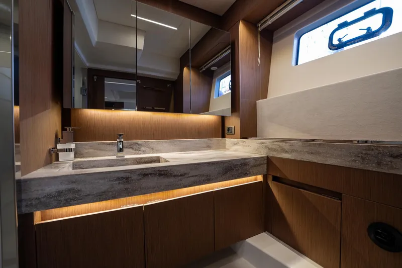  Yacht Photos Pics Luxurious bathroom interior of 2023 Prestige X60 yacht with modern fixtures and ambient lighting.