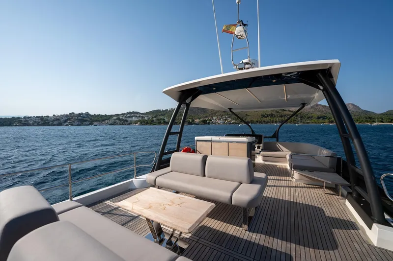  Yacht Photos Pics Luxurious 2023 Prestige X60 yacht deck with elegant seating and scenic ocean view.