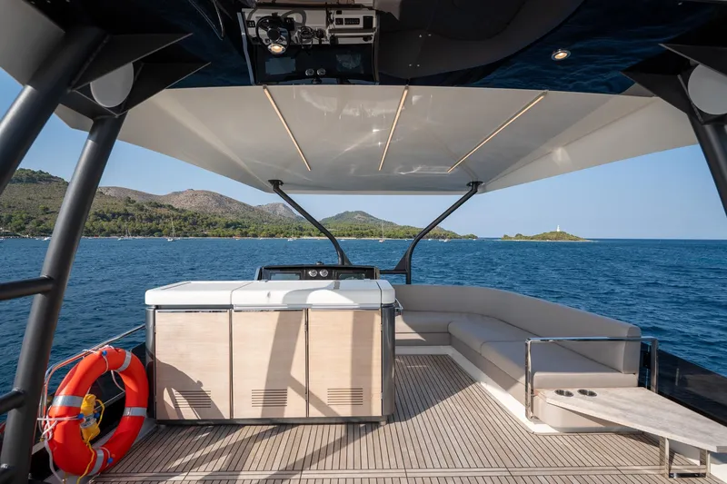  Yacht Photos Pics Luxurious 2023 Prestige X60 yacht deck with scenic ocean view and modern seating.