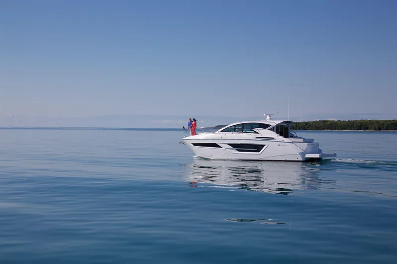  Yacht Photos Pics 2026 Cruisers Yachts 46 Cantius cruising on calm blue waters.