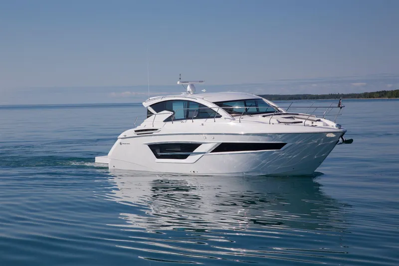  Yacht Photos Pics 2026 Cruisers Yachts 46 Cantius on calm water, showcasing sleek design and luxury features.