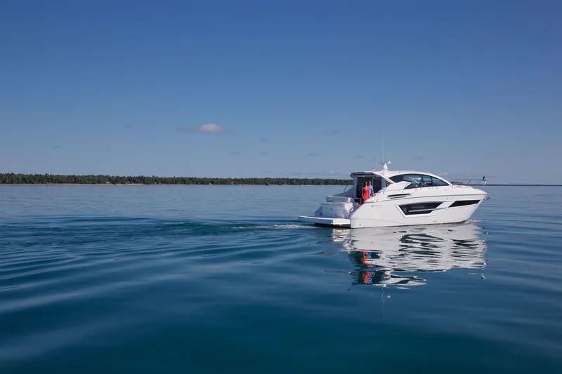  Yacht Photos Pics 2026 Cruisers Yachts 46 Cantius cruising on calm blue waters.