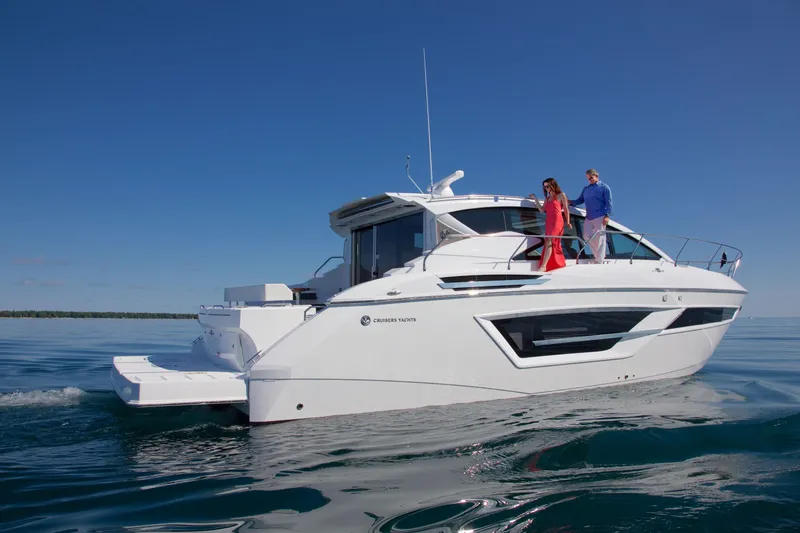  Yacht Photos Pics 2026 Cruisers Yachts 46 Cantius on calm water, featuring sleek design and modern amenities.