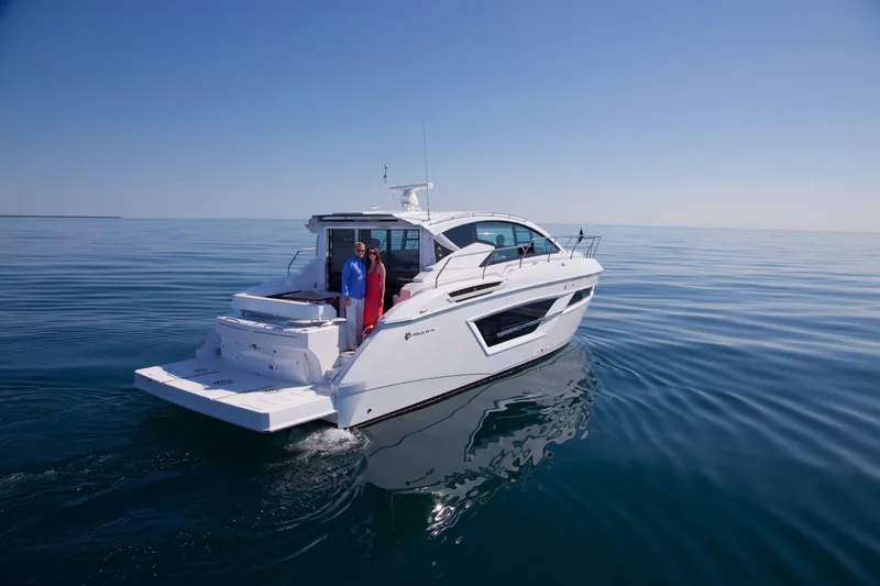  Yacht Photos Pics 2026 Cruisers Yachts 46 Cantius on calm sea with two people onboard.