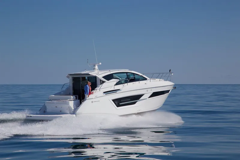  Yacht Photos Pics 2026 Cruisers Yachts 46 Cantius cruising on calm blue waters.