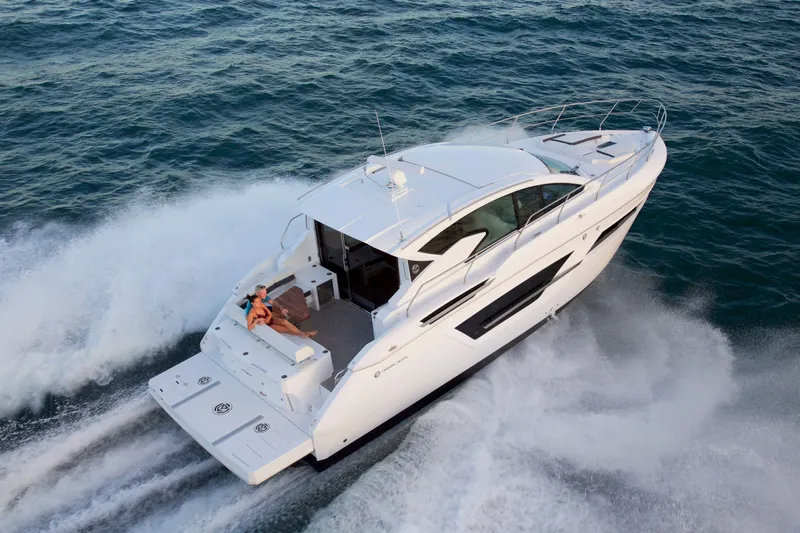  Yacht Photos Pics 2026 Cruisers Yachts 46 Cantius cruising on open water, showcasing sleek design and luxury.