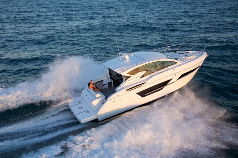  Yacht Photos Pics 2026 Cruisers Yachts 46 Cantius cruising on open water, showcasing sleek design and performance.