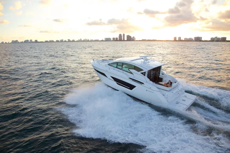  Yacht Photos Pics 2026 Cruisers Yachts 46 Cantius cruising at sunset on open water.