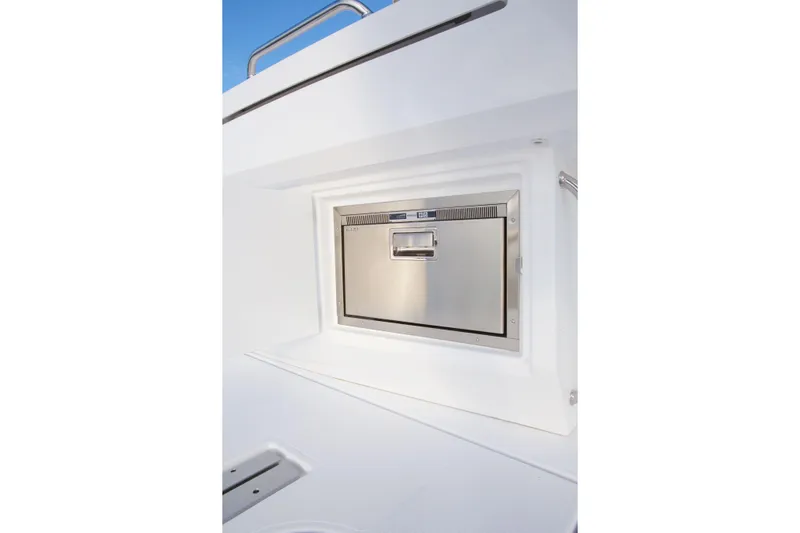  Yacht Photos Pics Stainless steel appliance on 2026 Cruisers Yachts 46 Cantius, set against a sleek white interior.