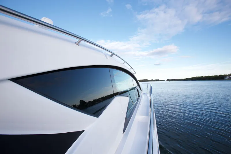  Yacht Photos Pics 2026 Cruisers Yachts 46 Cantius on serene water, showcasing sleek design and modern elegance.