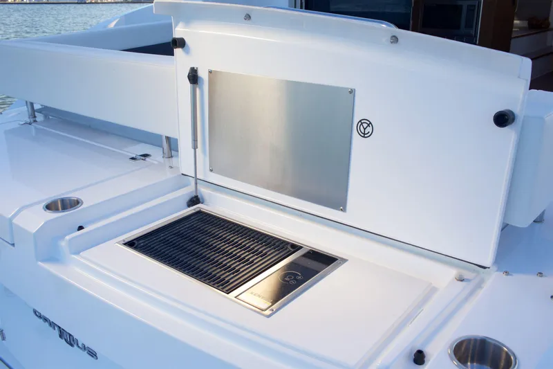  Yacht Photos Pics Outdoor grill on 2026 Cruisers Yachts 46 Cantius, featuring sleek design and modern amenities.