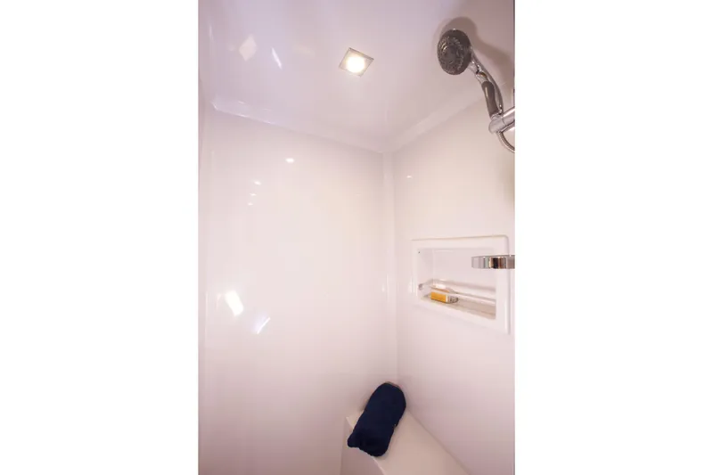  Yacht Photos Pics Luxurious shower interior of 2026 Cruisers Yachts 46 Cantius with modern fixtures.