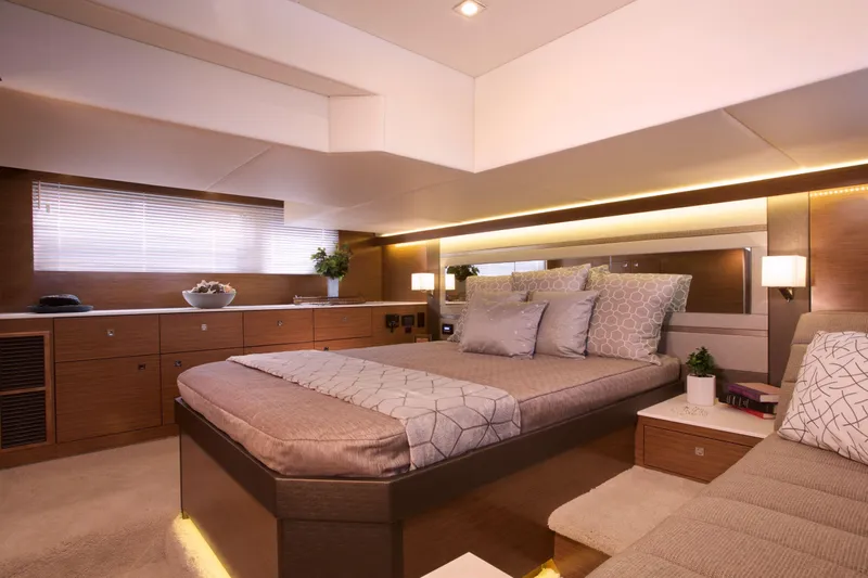  Yacht Photos Pics Luxurious bedroom interior of 2026 Cruisers Yachts 46 Cantius with modern decor.