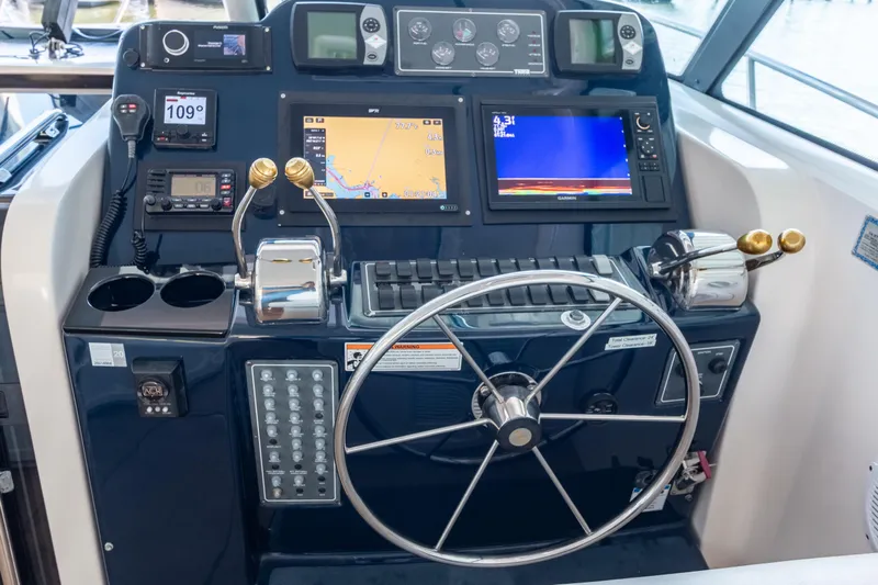 Her Majesty Yacht Photos Pics Helm of 2007 Tiara Yachts 3800 Open with navigation and control systems.