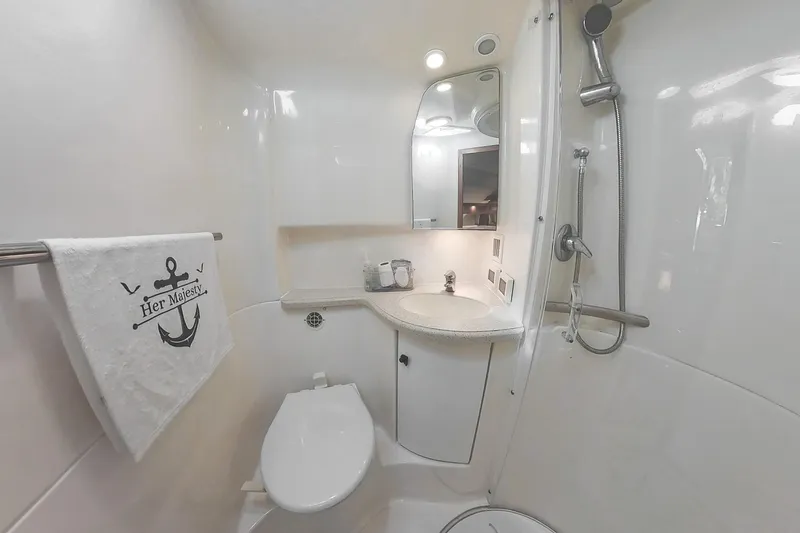 Her Majesty Yacht Photos Pics Luxurious 2007 Tiara Yachts 3800 Open bathroom with modern fixtures and elegant design.