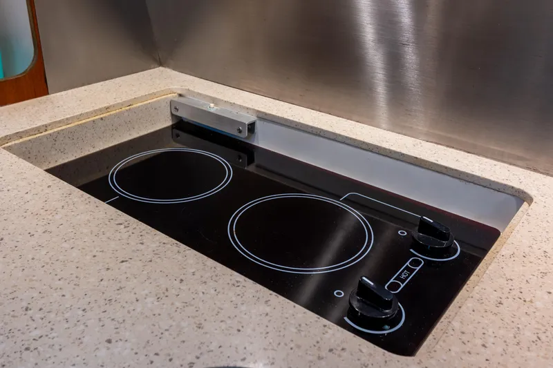 Her Majesty Yacht Photos Pics Modern stovetop in 2007 Tiara Yachts 3800 Open galley kitchen.