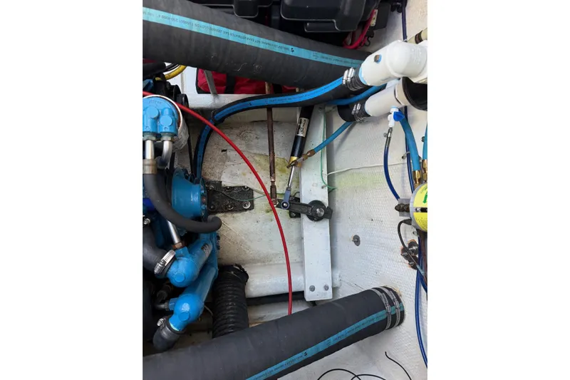 Ski Breeze Yacht Photos Pics Engine compartment of a 1996 Harbor Master 52 Wide Body with hoses and mechanical components.