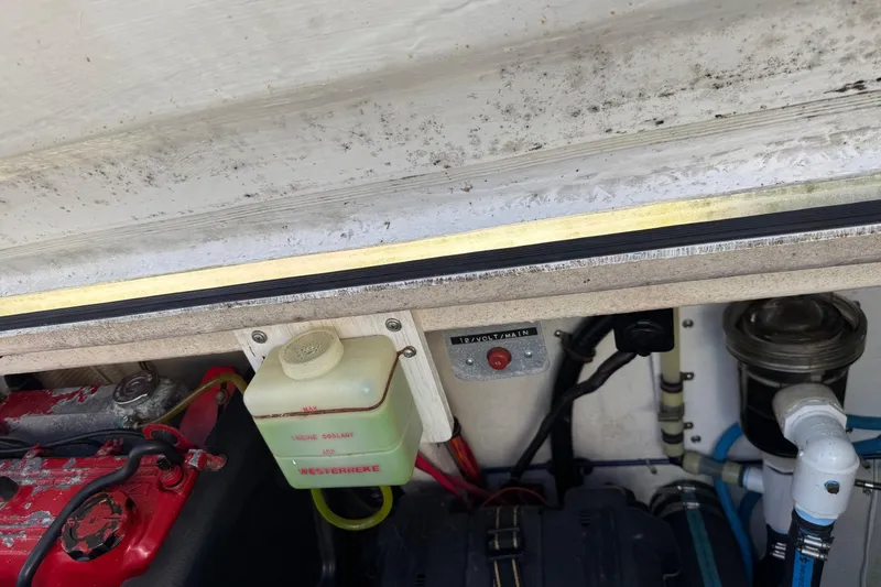 Ski Breeze Yacht Photos Pics Engine compartment of a 1996 Harbor Master 52 Wide Body boat, showing coolant and wiring.