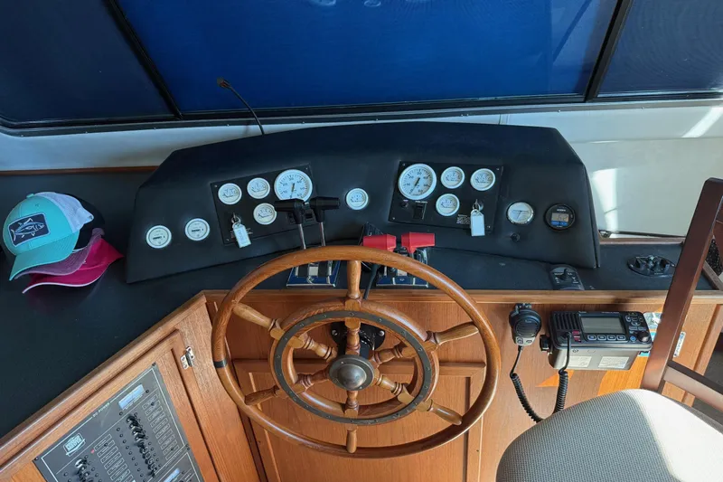 Ski Breeze Yacht Photos Pics Helm of 1996 Harbor Master 52 Wide Body with wooden wheel and control panel.