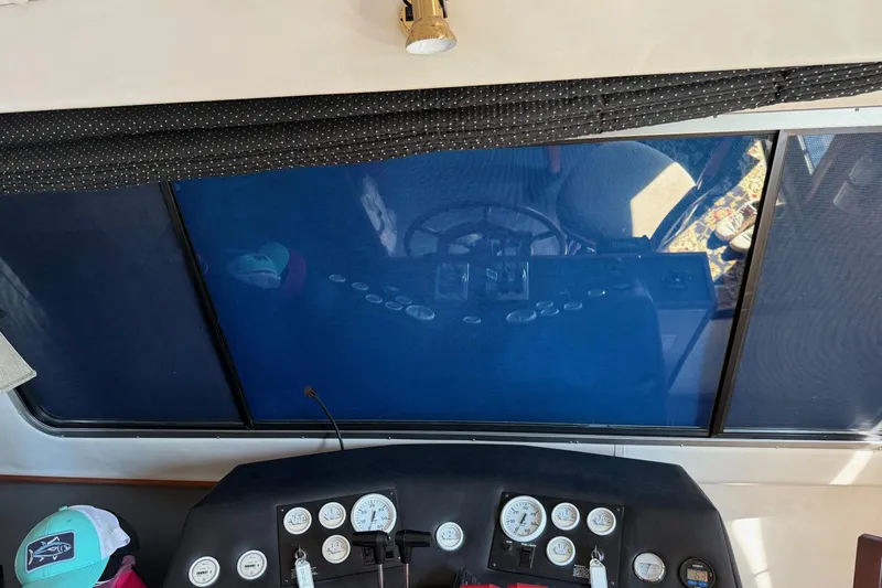 Ski Breeze Yacht Photos Pics Interior view of 1996 Harbor Master 52 Wide Body boat dashboard with gauges and controls.