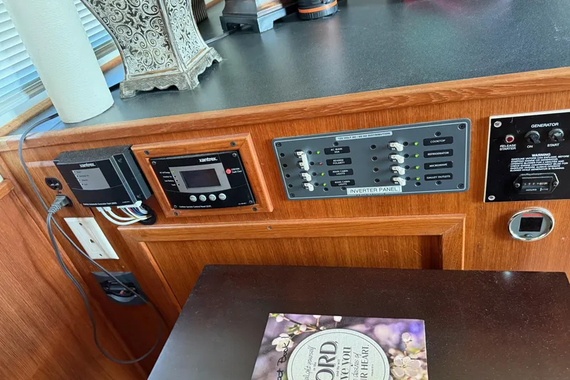 Ski Breeze Yacht Photos Pics Control panel of a 1996 Harbor Master 52 Wide Body boat with inverter and generator switches.