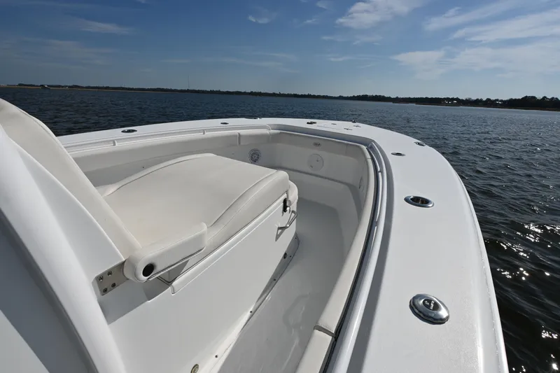  Yacht Photos Pics 2024 Sea Hunt Gamefish 28 boat on calm water, featuring spacious seating and sleek design.