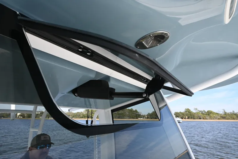  Yacht Photos Pics 2024 Sea Hunt Gamefish 28 boat with open window detail, on a calm water backdrop.