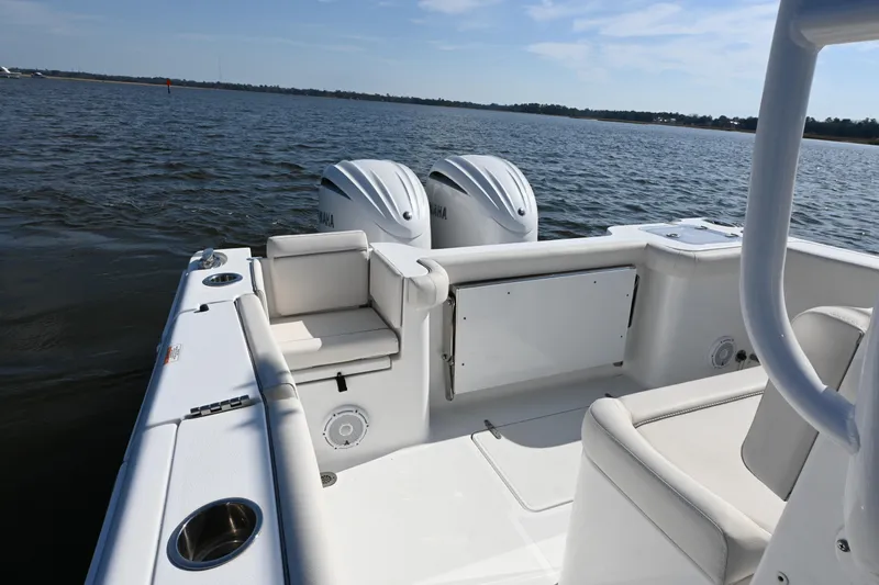  Yacht Photos Pics 2024 Sea Hunt Gamefish 28 boat interior with dual engines on open water.