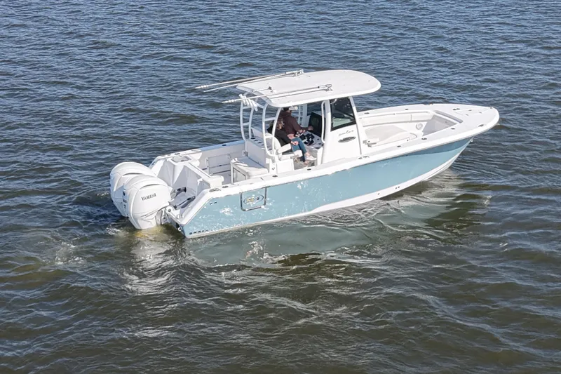  Yacht Photos Pics 2024 Sea Hunt Gamefish 28 boat cruising on open water with dual Yamaha engines.