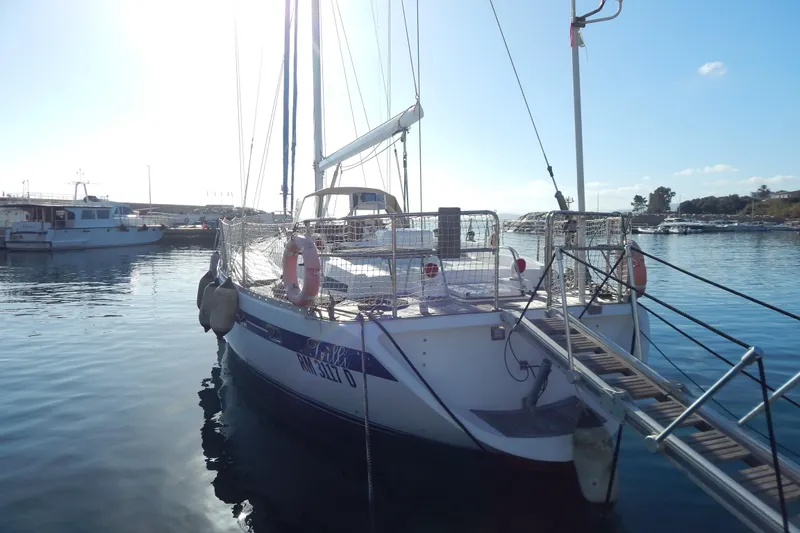 Yacht Photos Pics Sailboat docked in marina, Tayana 55, 1992 model, sunny day.