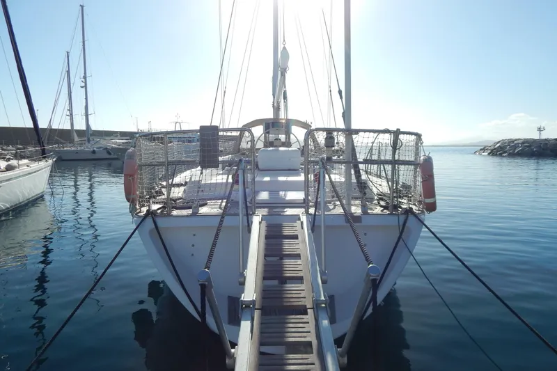  Yacht Photos Pics Sailboat docked in marina, Tayana 55 model, 1992, with clear blue sky.