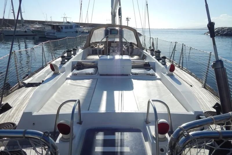  Yacht Photos Pics Sailing yacht Tayana 55, 1992 model, docked in a marina under clear skies.