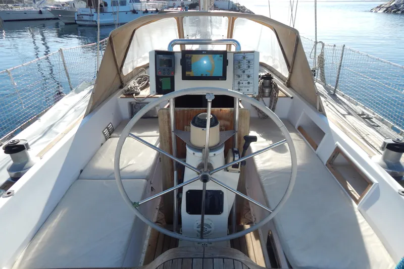  Yacht Photos Pics Cockpit of 1992 Tayana 55 sailboat with steering wheel and navigation equipment.