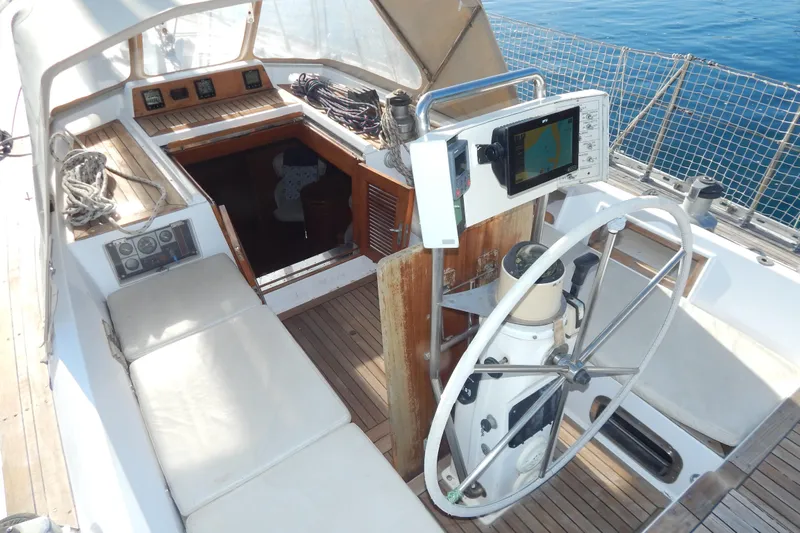  Yacht Photos Pics Cockpit of 1992 Tayana 55 sailboat with navigation equipment and steering wheel.