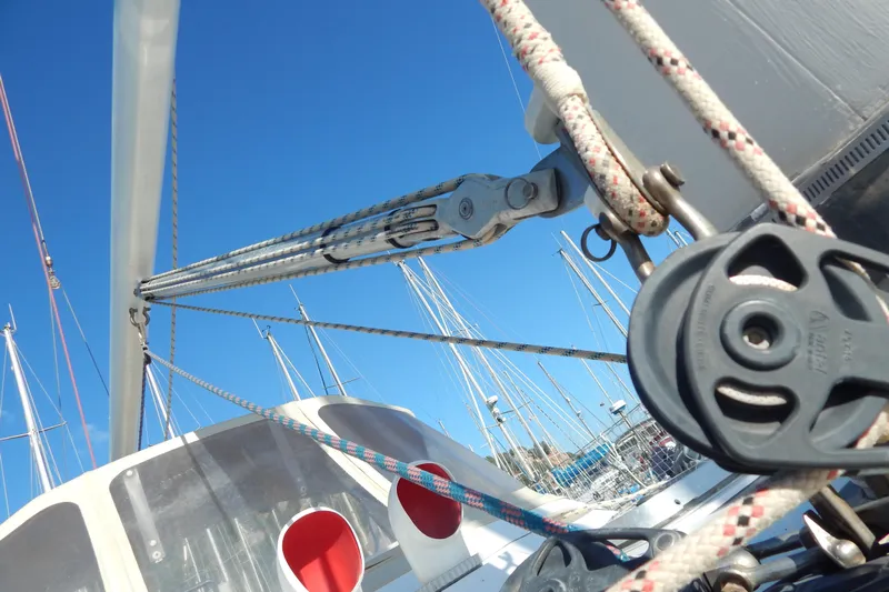  Yacht Photos Pics Close-up of rigging on a 1992 Tayana 55 sailboat under clear blue sky.