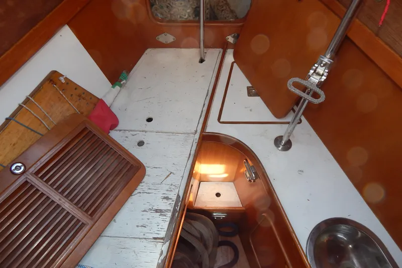  Yacht Photos Pics Interior of 1992 Tayana 55 sailboat with wooden cabinetry and storage compartments.