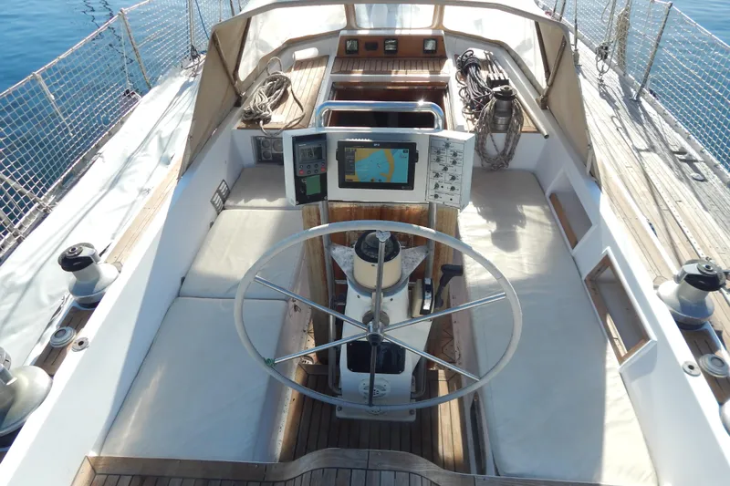  Yacht Photos Pics Cockpit of 1992 Tayana 55 sailboat with navigation equipment and steering wheel.