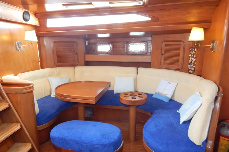  Yacht Photos Pics Luxurious 1992 Tayana 55 yacht interior with cozy seating and elegant wooden finishes.