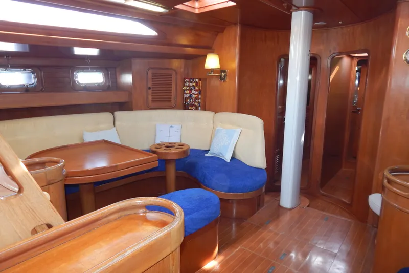  Yacht Photos Pics Luxurious 1992 Tayana 55 yacht interior with wooden finish and cozy seating area.