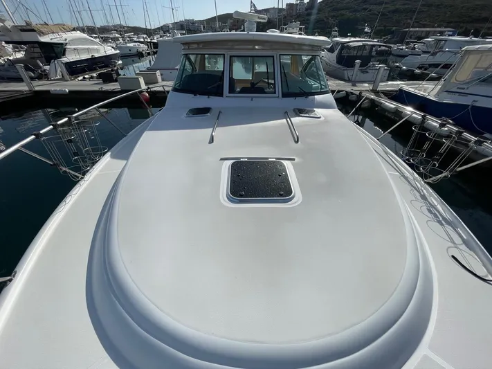  Yacht Photos Pics 2007 Tiara Yachts 3800 Open docked at marina, showcasing sleek deck design.