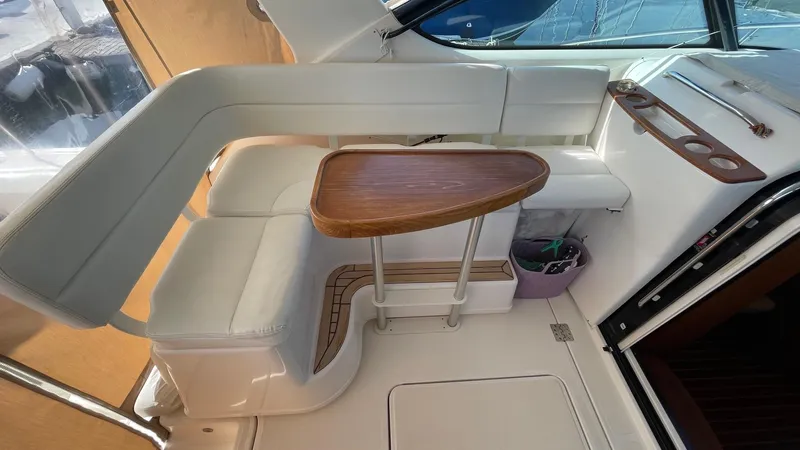  Yacht Photos Pics 2007 Tiara Yachts 3800 Open interior with white seating and wooden table.