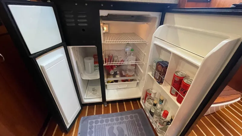  Yacht Photos Pics Open refrigerator on 2007 Tiara Yachts 3800 Open, stocked with drinks and essentials.