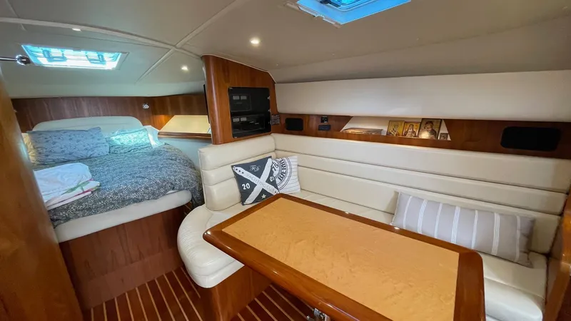  Yacht Photos Pics Luxurious interior of 2007 Tiara Yachts 3800 Open with cozy seating and bed.