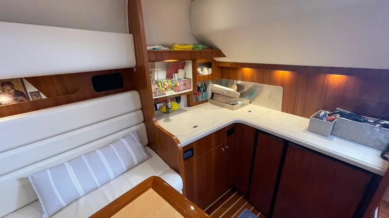  Yacht Photos Pics 2007 Tiara Yachts 3800 Open interior with cozy seating and well-organized kitchenette.