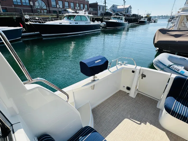 On Holidays - Reserved Yacht Photos Pics 2018 Sabre 42 Salon Express yacht docked in a marina, featuring a spacious deck area.