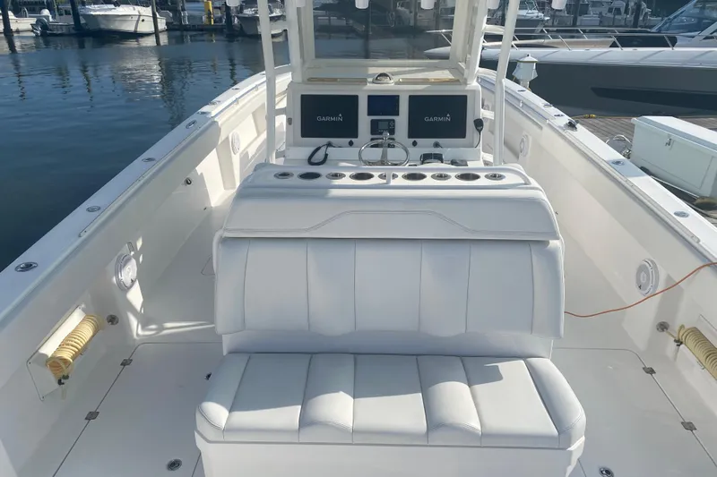 Trailer Included Yacht Photos Pics 2019 Invincible 40 Catamaran interior with white seating and Garmin navigation system.
