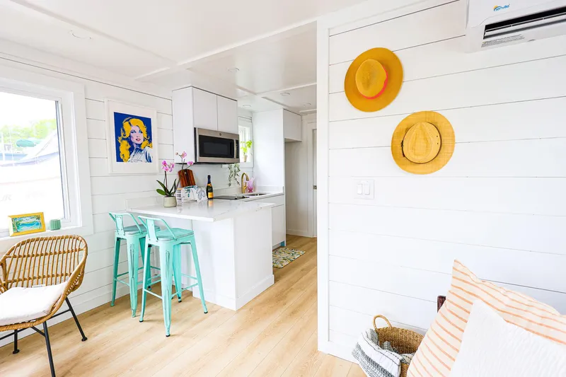  Yacht Photos Pics Modern interior of Hank's 40 Houseboat, featuring a bright kitchen and stylish decor, 2025 model.