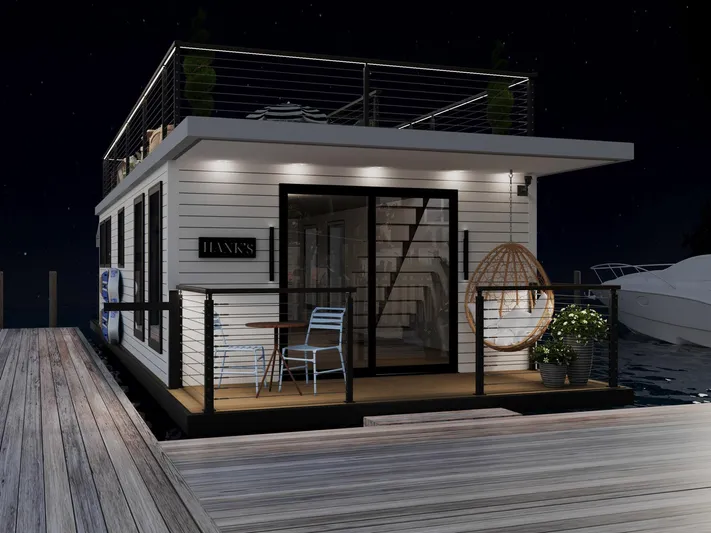  Yacht Photos Pics Modern 2025 Hank's 40 Houseboat docked at night, featuring stylish outdoor seating.