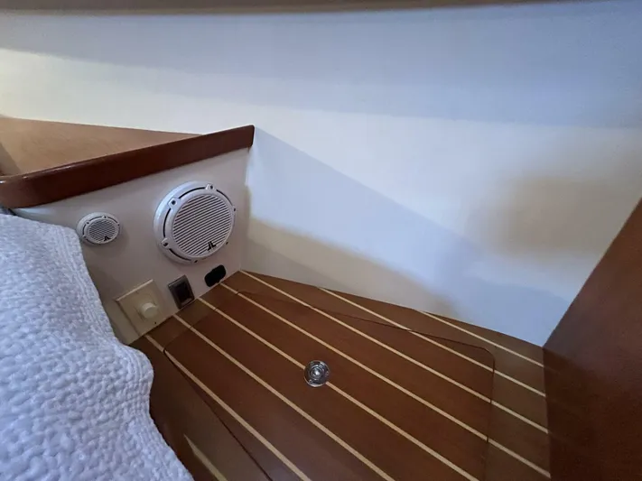 N'baluba Yacht Photos Pics 2008 Rivolta Coupe 4.5 interior with wood paneling and speaker system.